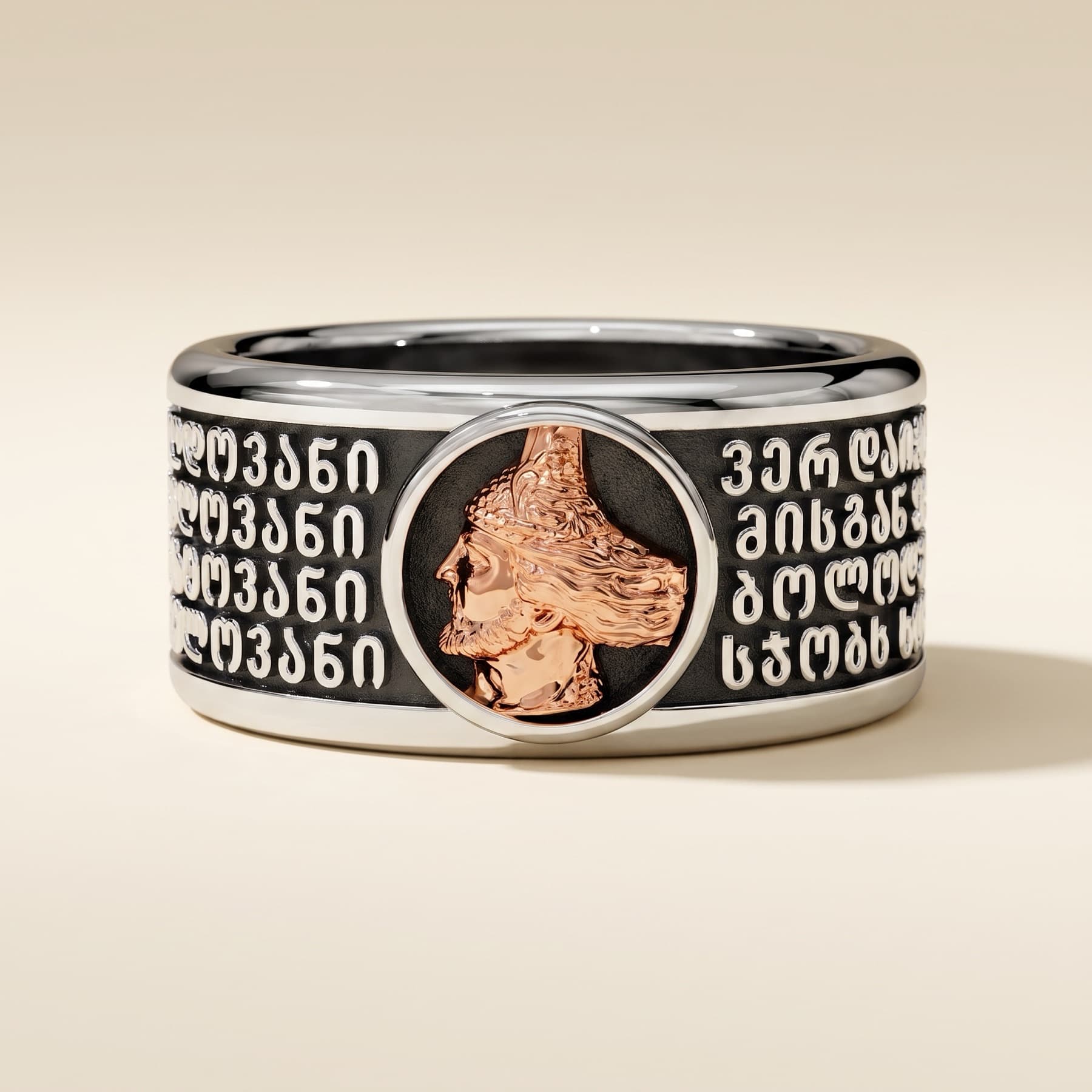 Vepkhistqaosani — silver ring with a rose-gold medallion and raised Georgian inscription